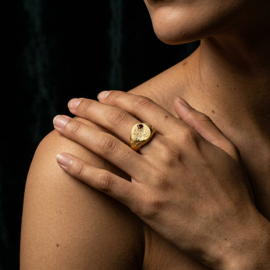 Hand engraved Chrysanthemum signet ring in 18k gold on hand by Mier Theo