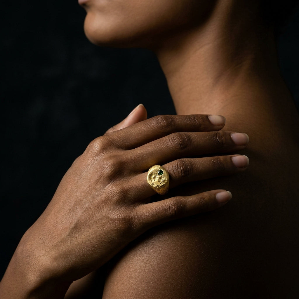 Hand engraved Cosmos signet ring in 18k gold on hand by Mier Theo