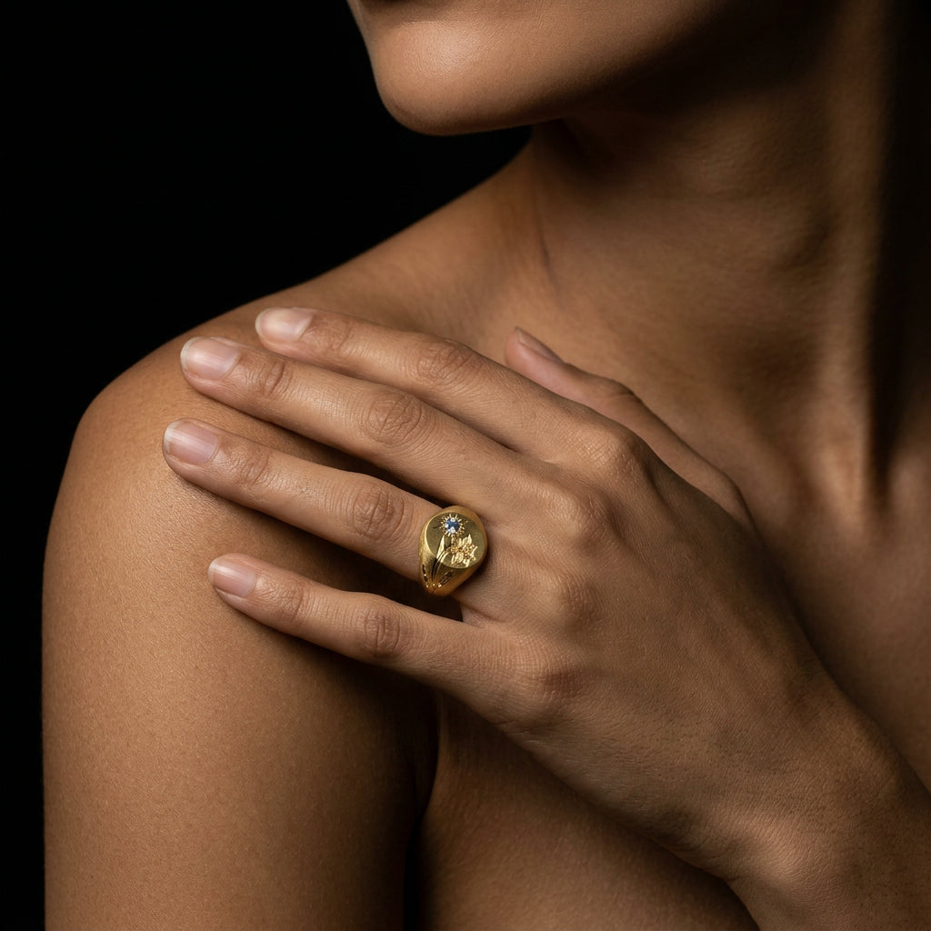 Hand engraved Daffodil signet ring in 18k gold on hand by Mier Theo