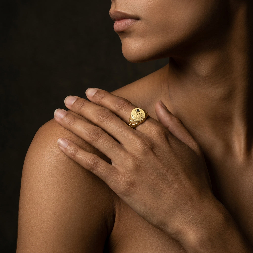 Hand engraved Honeysuckle signet ring in 18k gold on hand by Mier Theo