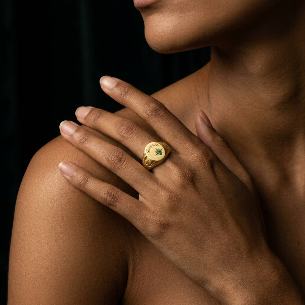 Hand engraved Lily of the Valley signet ring in 18k gold on hand by Mier Theo