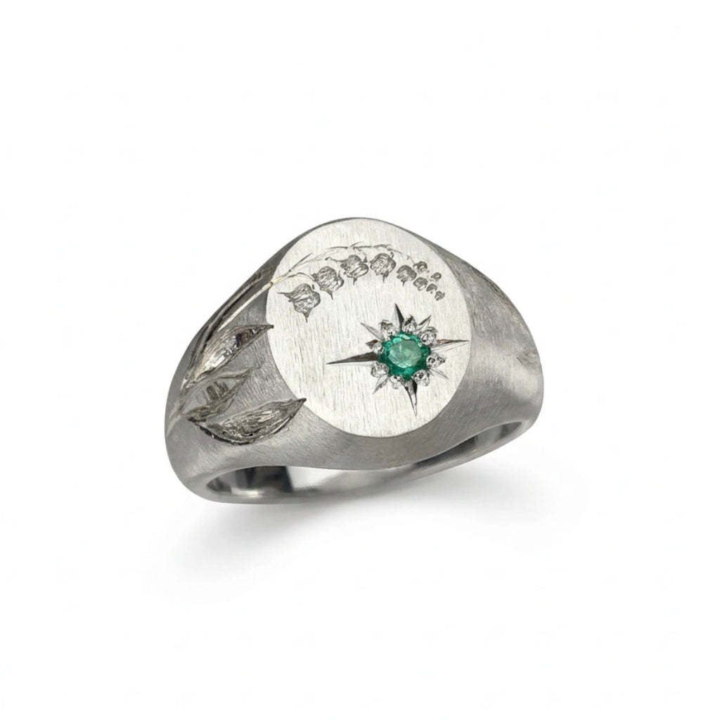 Hand engraved Lily of the Valley signet ring in 940 Silver. Angled view. Engraved by Mier Theo