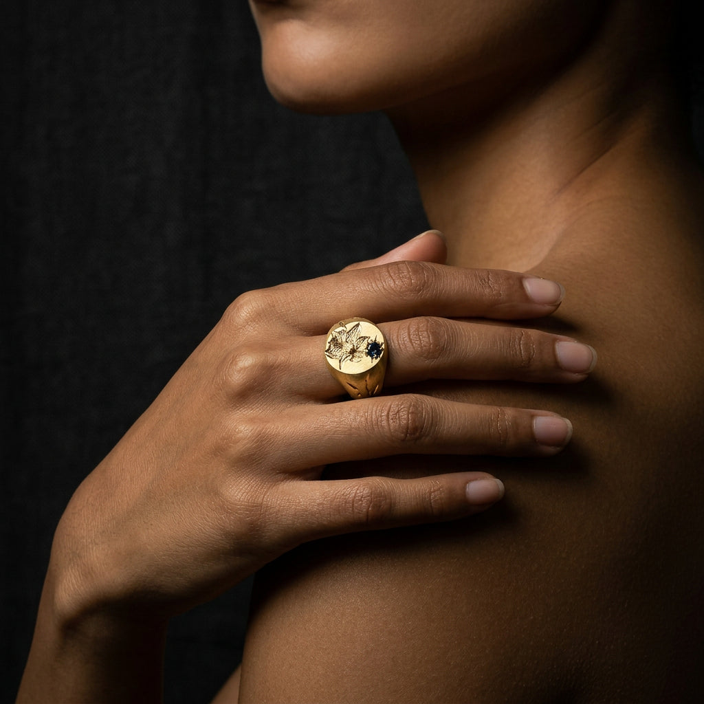 Hand engraved Narcissus signet ring in 18k gold on hand by Mier Theo