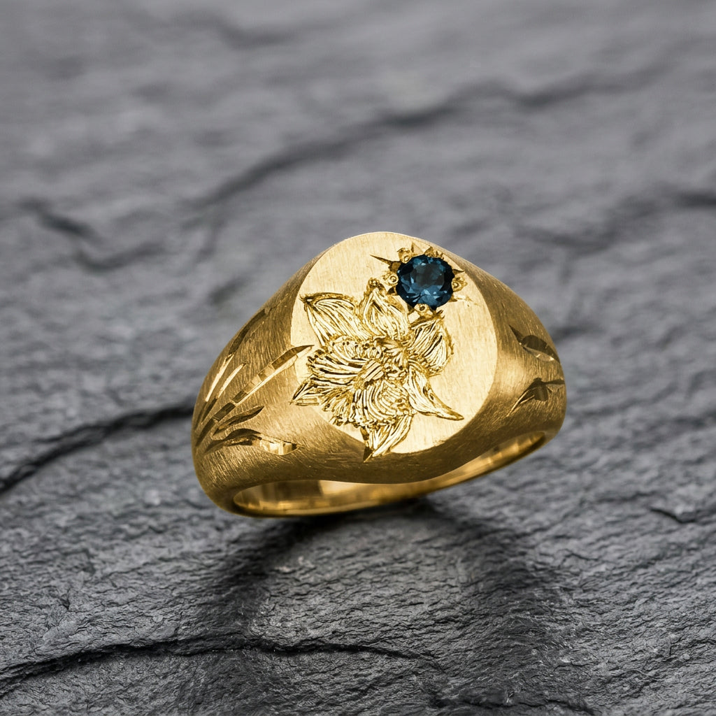 Hand engraved Narcissus signet ring in 18k gold on slate by Mier Theo