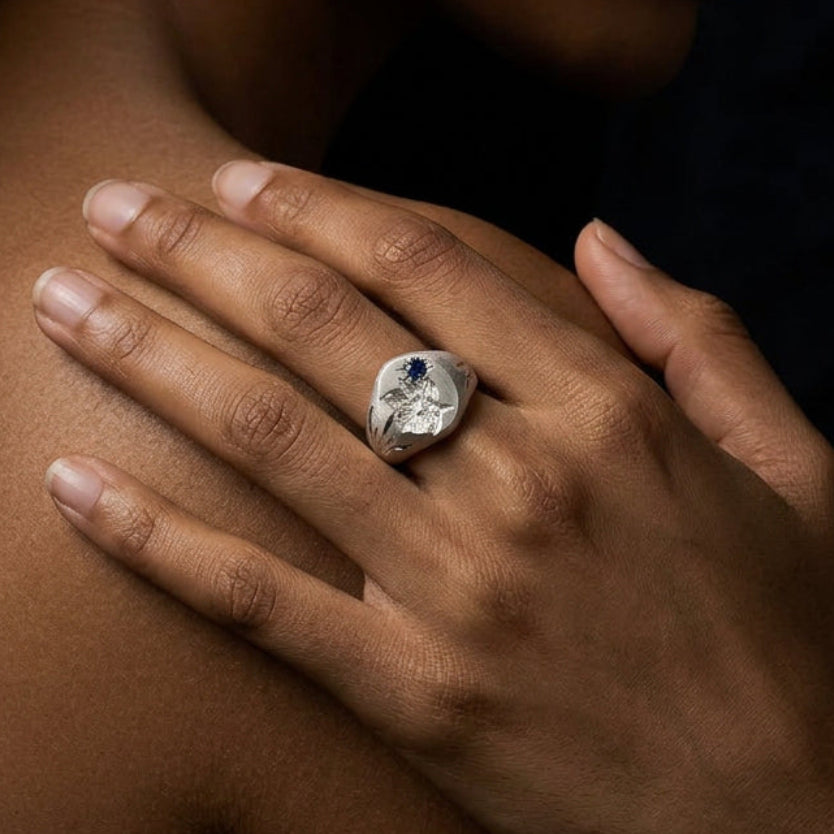 Hand engraved Narcissus signet ring in 940 Silver on hand by Mier Theo