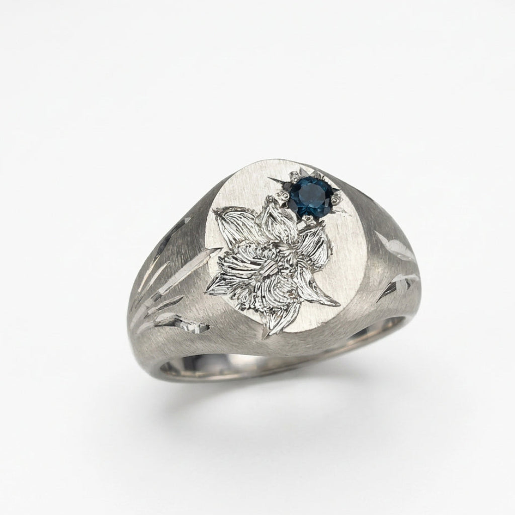 Hand engraved Snowdrop signet ring in 940 Silver. Angled view. Engraved by Mier Theo