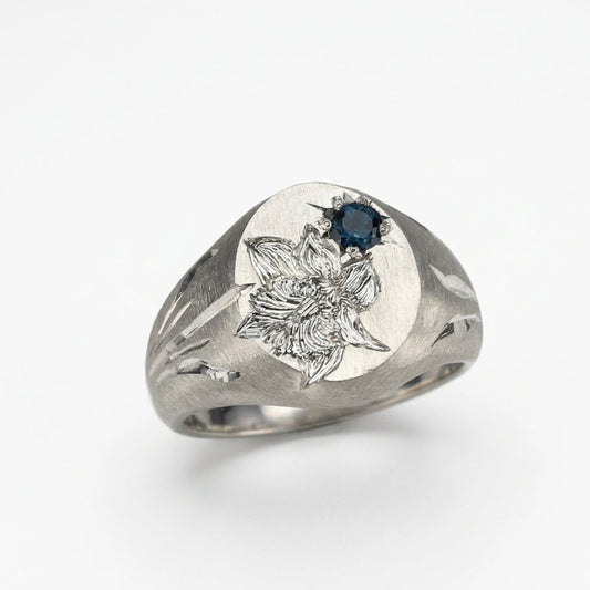 Hand engraved Snowdrop signet ring in 940 Silver. Angled view. Engraved by Mier Theo