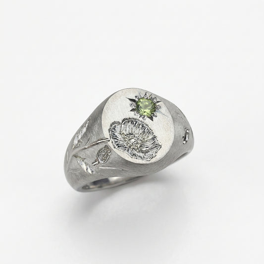 Hand engraved Poppy signet ring in 940 Silver. Angled view. Engraved by Mier Theo
