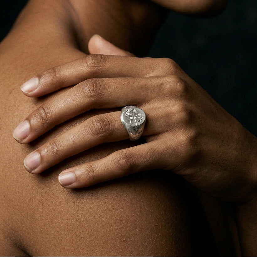 Hand engraved Sweet Pea signet ring in 940 Silver on hand by Mier Theo