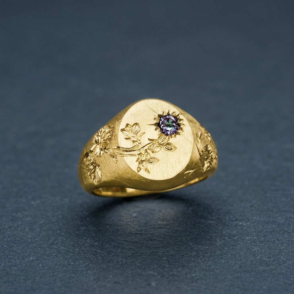 Hand engraved Violet signet ring in 18k gold on slate by Mier Theo
