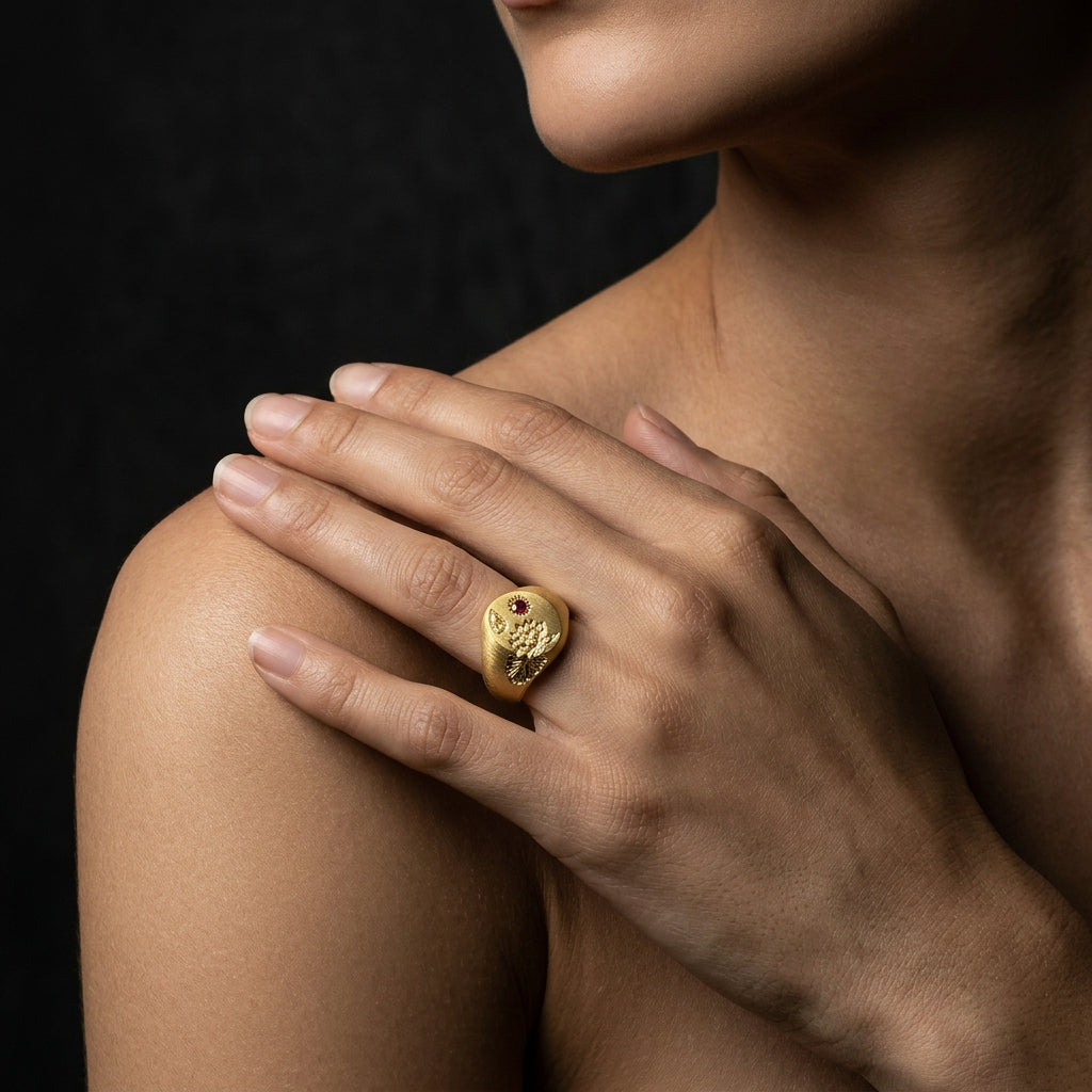 Hand engraved Water Lily signet ring in 18k gold on hand by Mier Theo